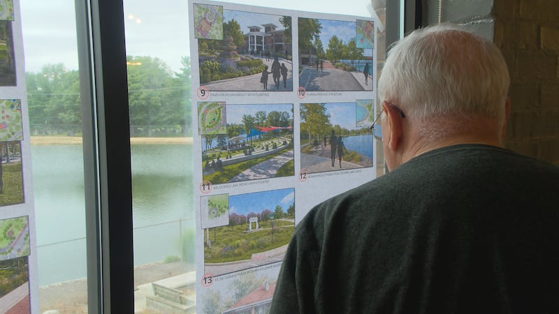 A community member looks at renderings of proposed changes for Bloomington's Miller Park.