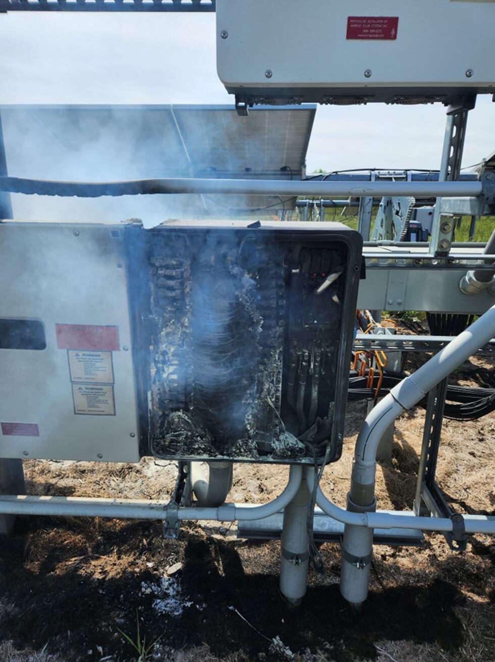 Inverter panel burns under solar array intended to produce electricity at a farm near Farmington.