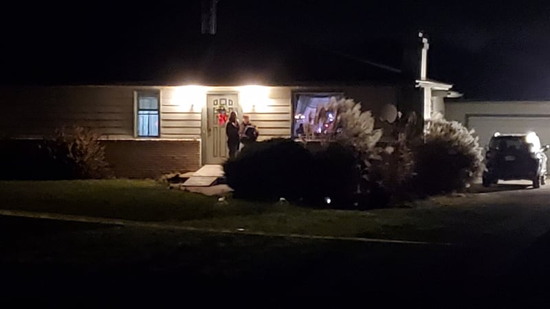 Police are seen at a Fort Wayne, Ind., house in which four people were killed in a shooting.