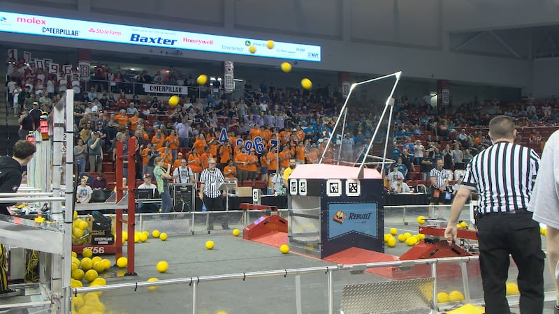 A student made robot hits an 8-foot-tall target with foam balls at the FIRST Robotics Regional...